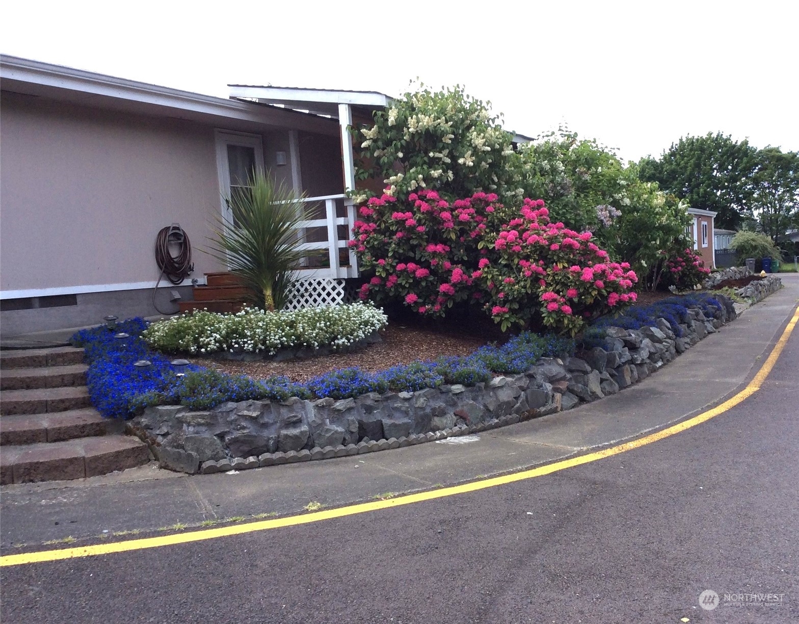 2505 South 371st Street, Unit 37 Federal Way, WA 98003 - Photo 27 of 27 a front view of a house having yard
