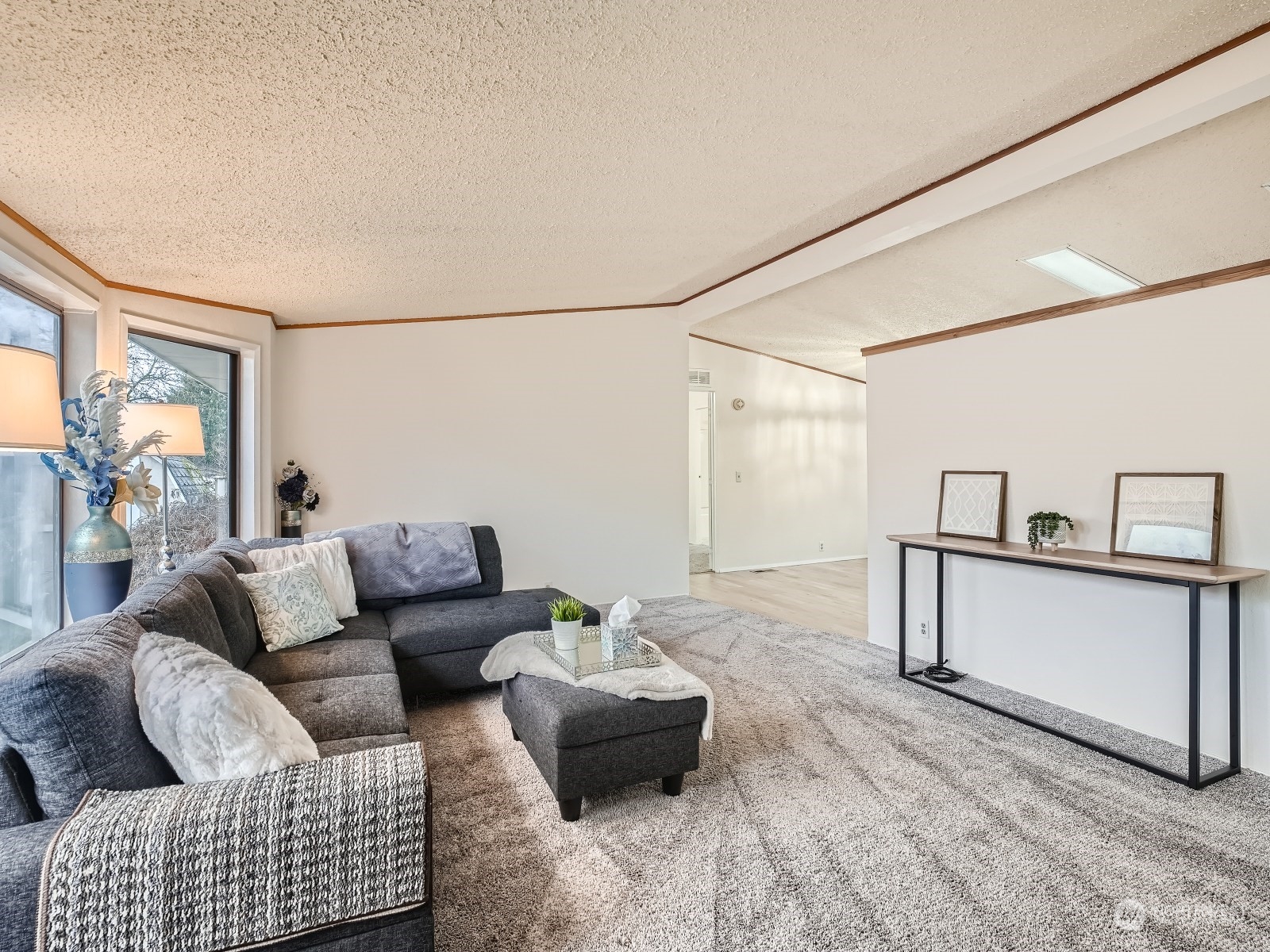 2505 South 371st Street, Unit 37 Federal Way, WA 98003 - Photo 4 of 27 a living room with furniture and a wooden floor