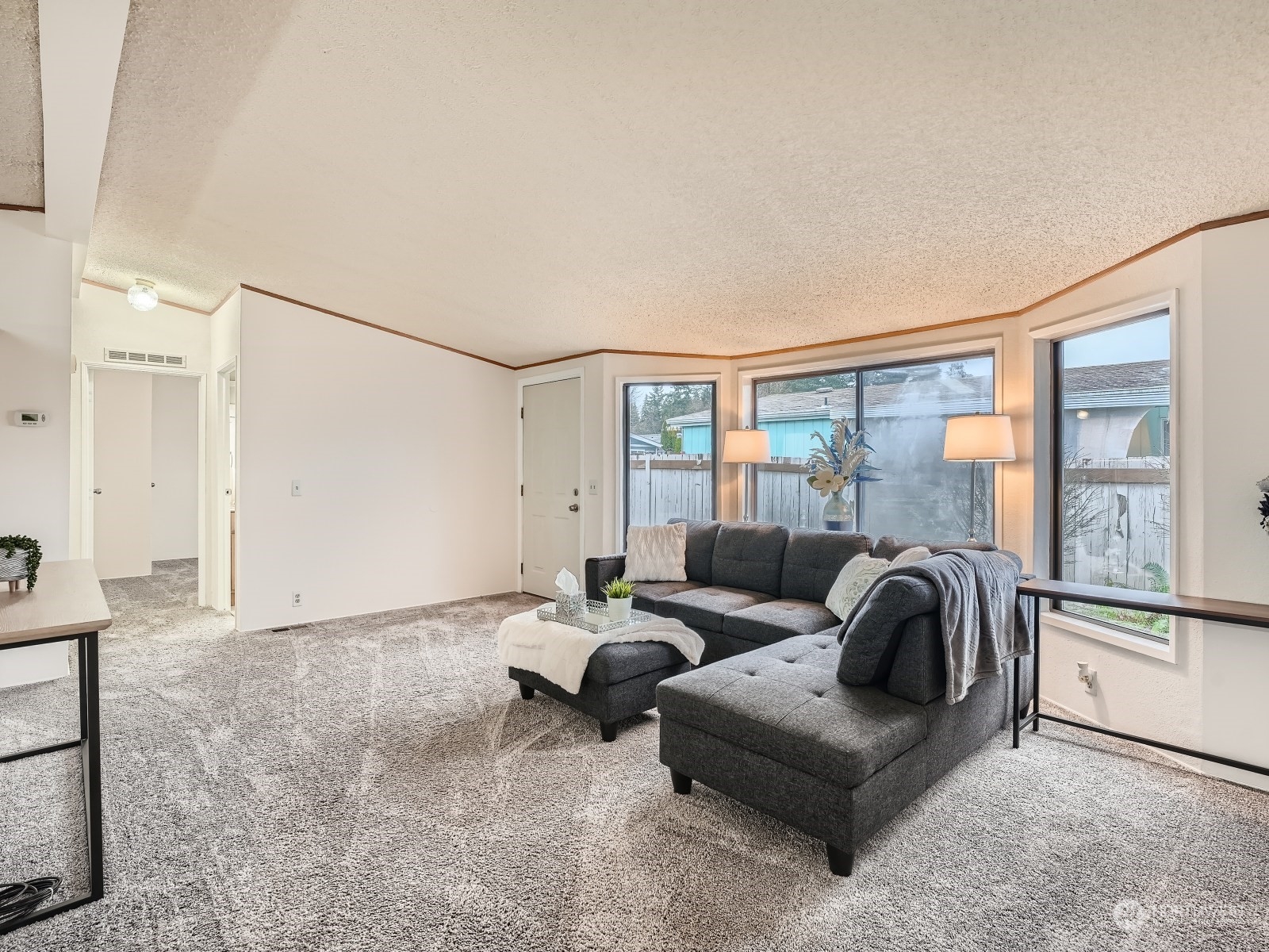 2505 South 371st Street, Unit 37 Federal Way, WA 98003 - Photo 6 of 27 a living room with furniture and a large window