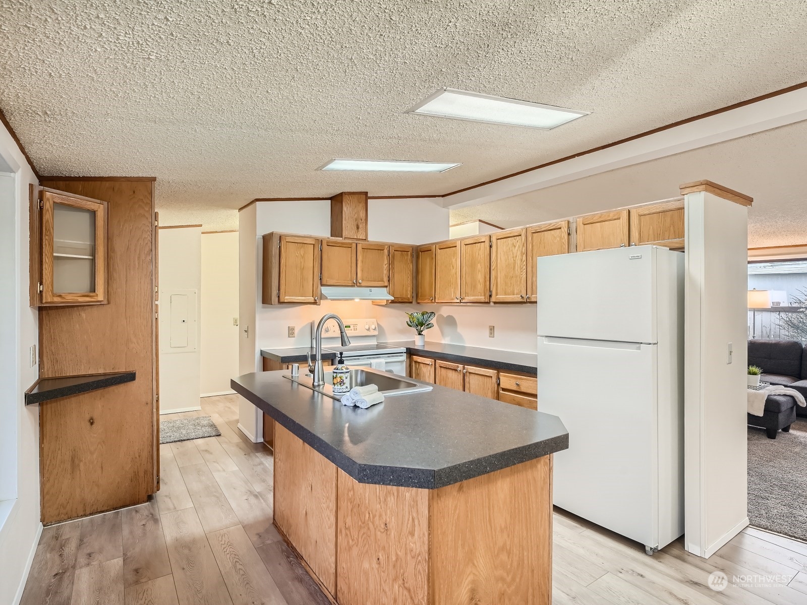 2505 South 371st Street, Unit 37 Federal Way, WA 98003 - Photo 7 of 27 a kitchen with stainless steel appliances granite countertop a sink stove and refrigerator