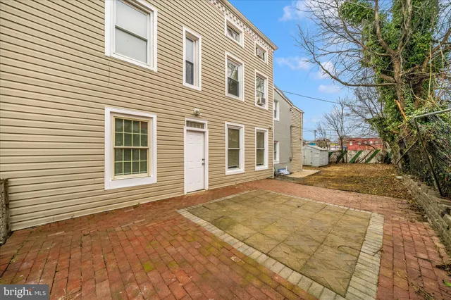 a view of a house with a snow on the road