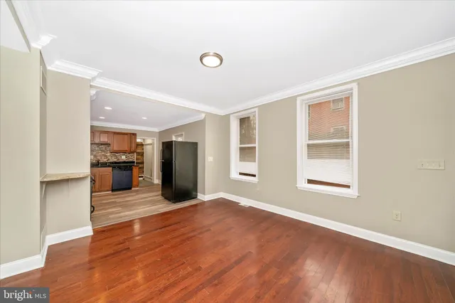 a view of a kitchen with a sink and a large window