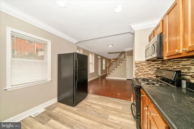 a view of a kitchen with a sink and dishwasher