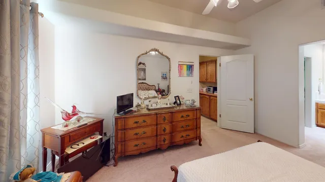 a bed room with a bed and a dresser