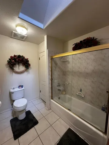 a bathroom with a toilet a sink and a shower