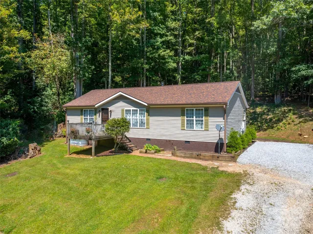 a aerial view of a house with swimming pool and porch