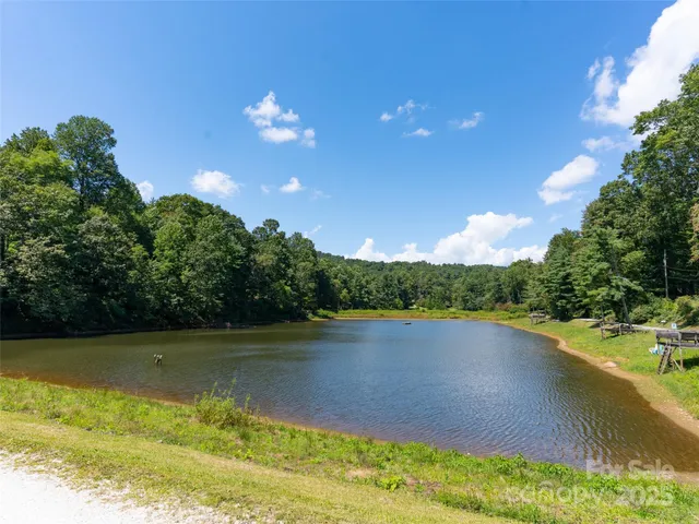 a view of a lake with a yard