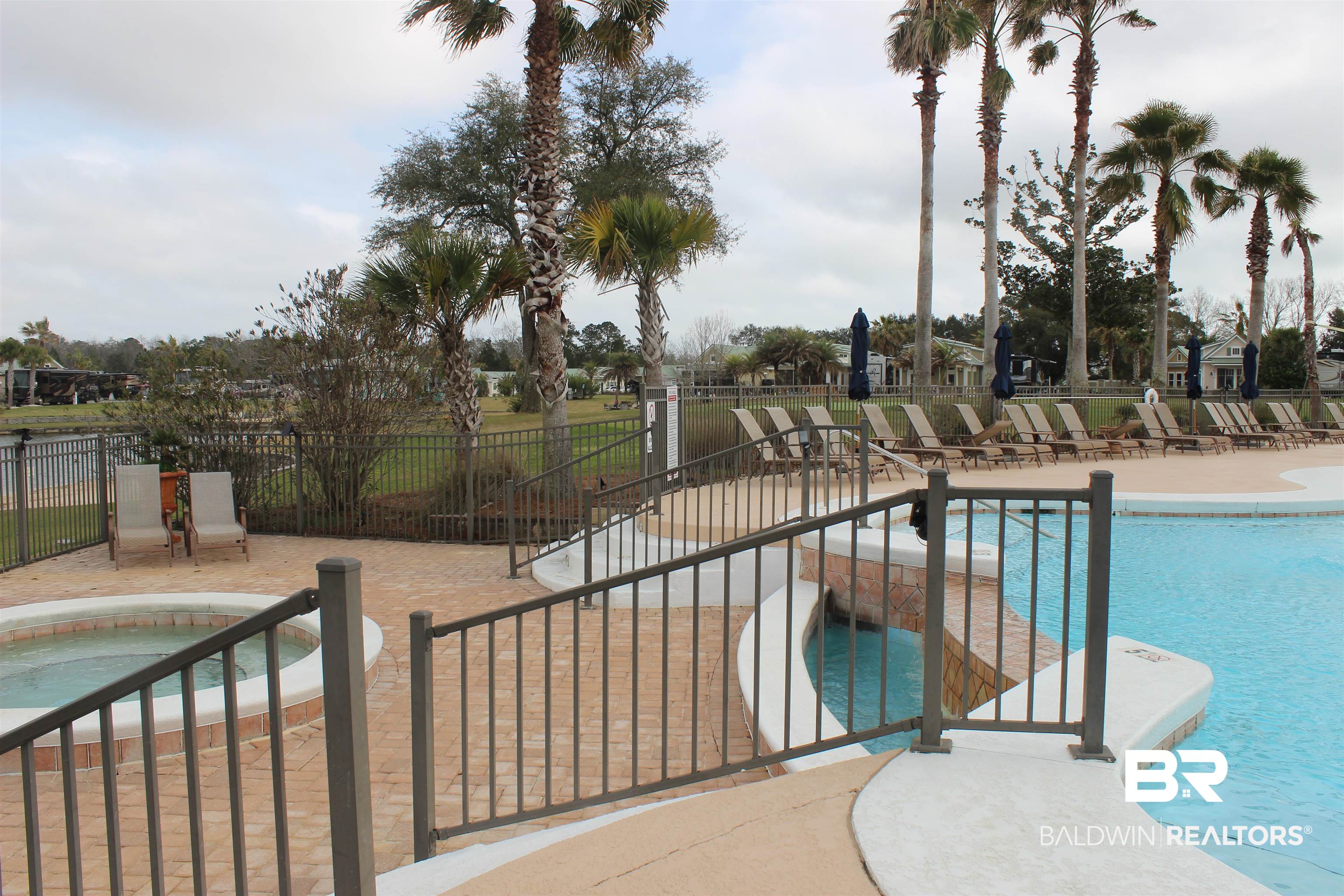 12377 Gateway Drive Elberta, AL 36530 - Photo 43 of 64 Community pool featuring a community hot tub and a patio area