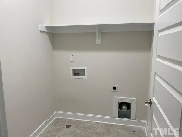 a room with a fireplace and a view of bedroom