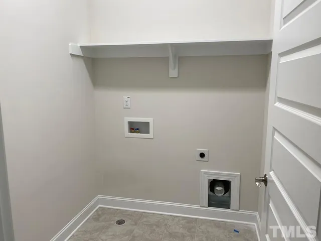 a room with a fireplace and a view of bedroom