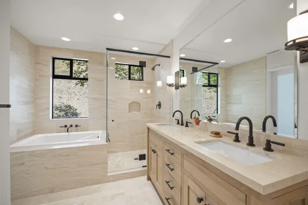 a bedroom with a large bed and a large window