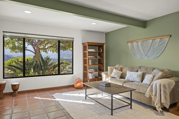 a living room with furniture and a large window