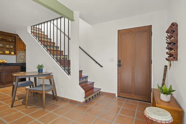 a bedroom with a large bed and a large window