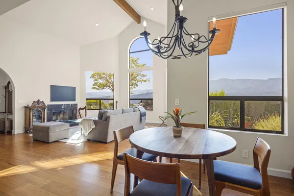 a view of a dining room with furniture window and outside view