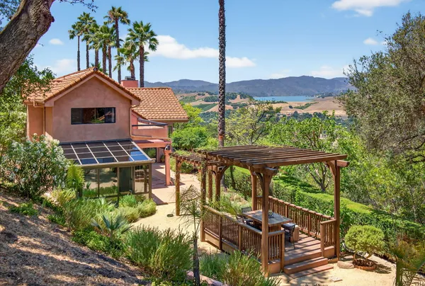 a view of a chairs and table in the patio