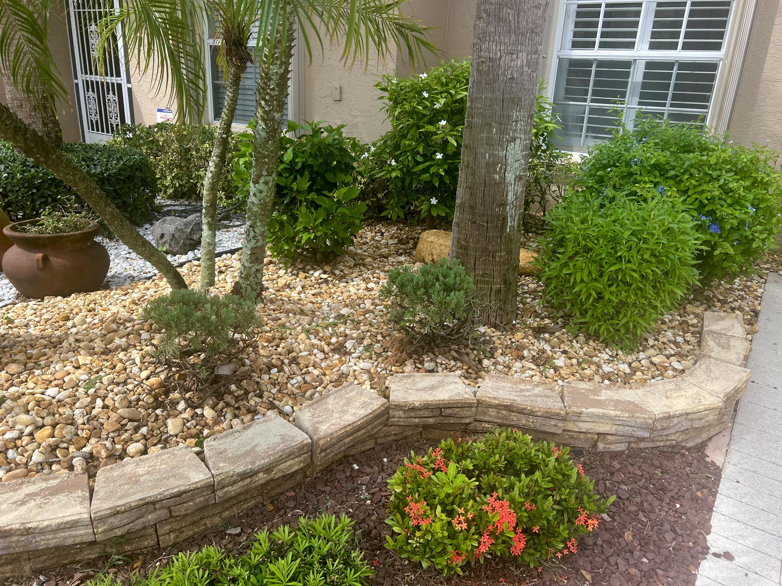 8425 Logia Circle Boynton Beach, FL 33472 - Photo 4 of 52 Updated front landscaping!