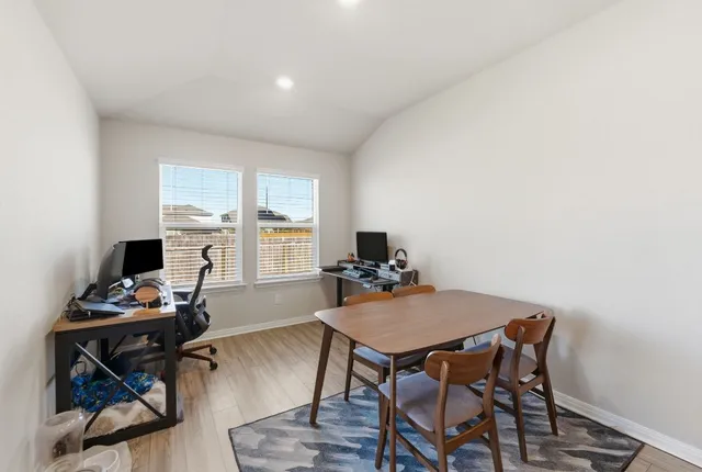 a view of a dining room with furniture