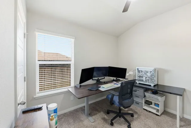 a workspace with furniture and a wooden floor