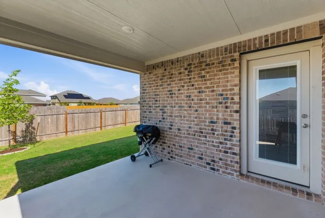 a bathroom with a shower and a sink