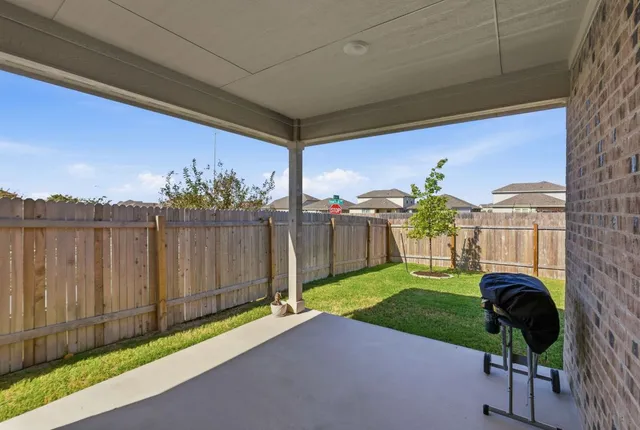 a view of backyard with a garden and plants