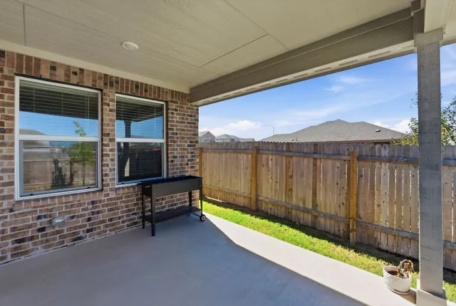 a garden with trees in front of it