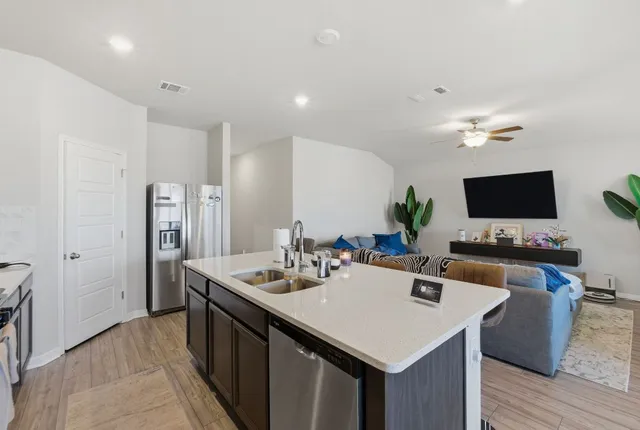 a view of a house with backyard and porch