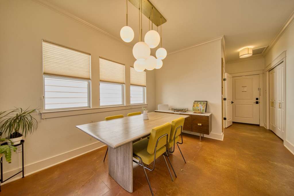 4113 Camacho Street Austin, TX 78723 - Photo 17 of 36 a workspace with chandelier and a table