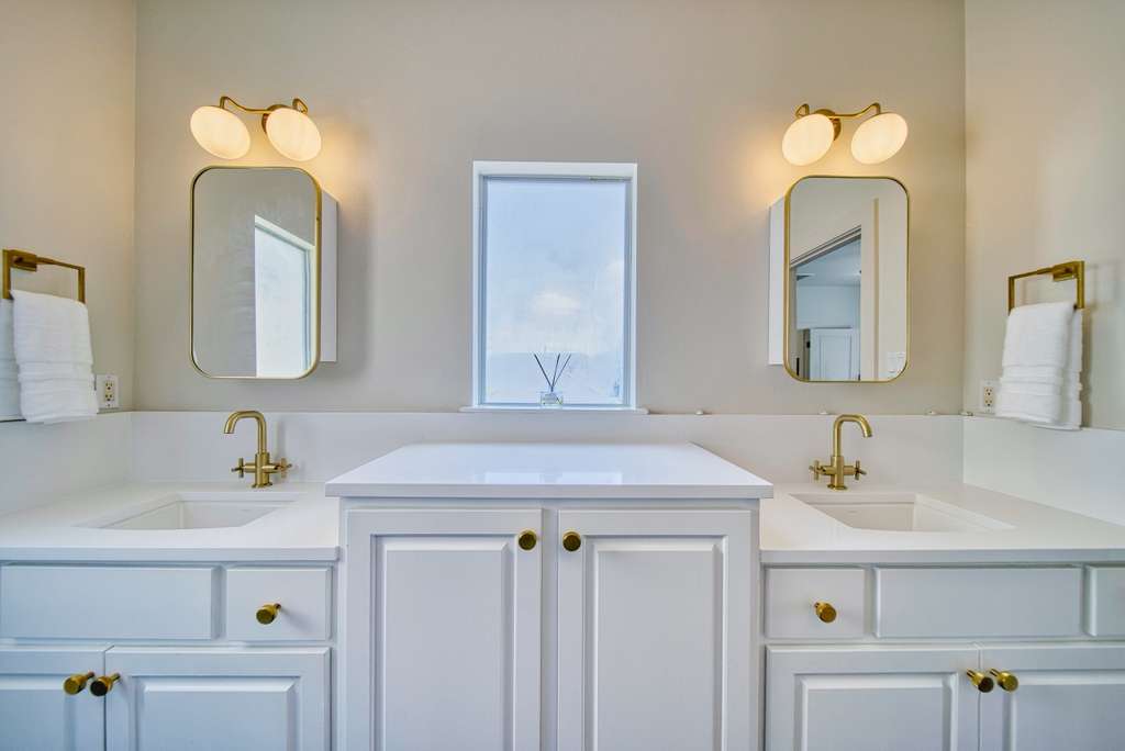 4113 Camacho Street Austin, TX 78723 - Photo 20 of 36 a bathroom with a sink vanity and a mirror