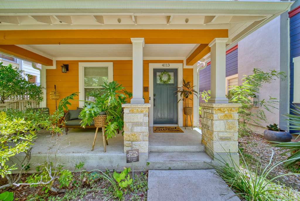 4113 Camacho Street Austin, TX 78723 - Photo 2 of 36 a front view of a house with a yard