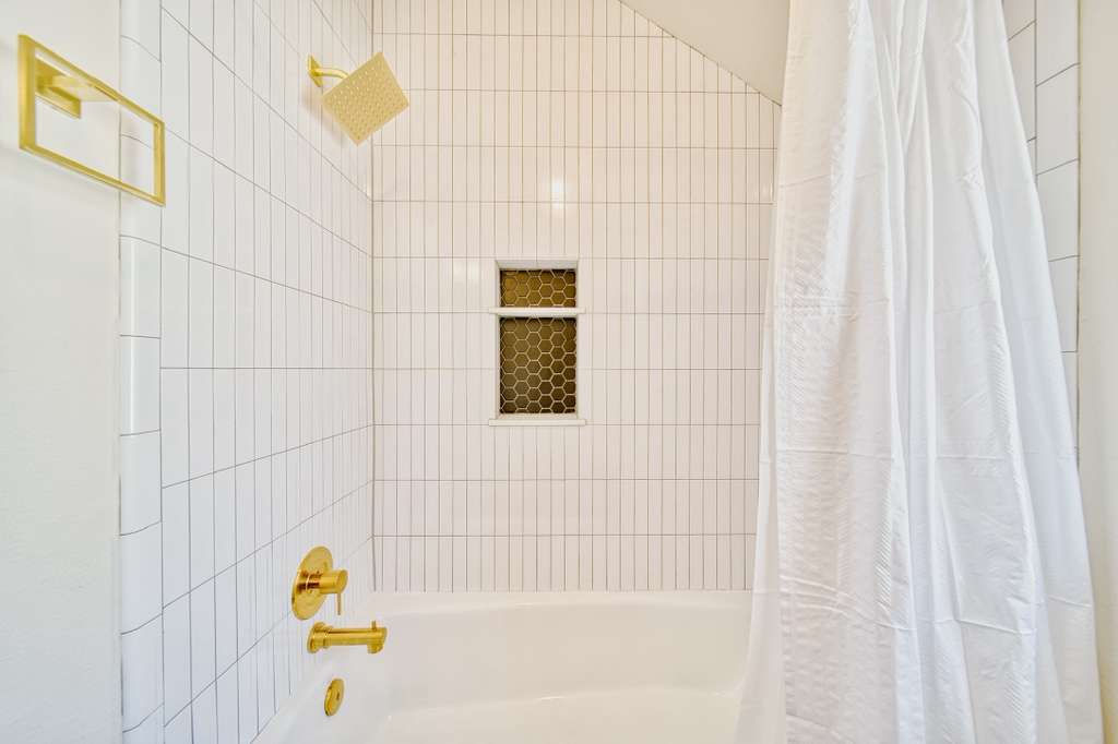 4113 Camacho Street Austin, TX 78723 - Photo 24 of 36 a bathroom with a bathtub