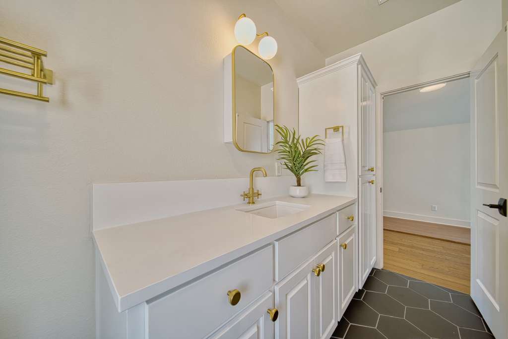 4113 Camacho Street Austin, TX 78723 - Photo 25 of 36 a bathroom with a sink and a mirror
