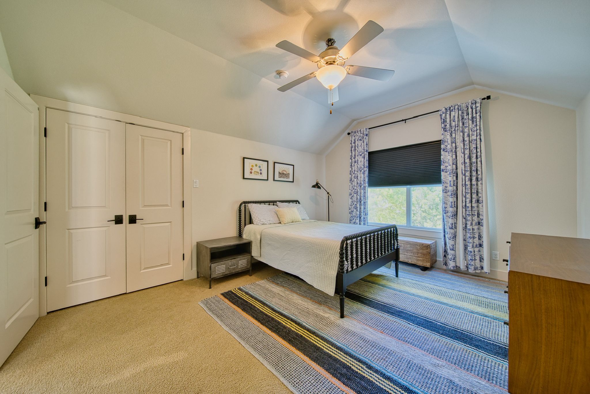 4113 Camacho Street Austin, TX 78723 - Photo 26 of 36 a bedroom with a bed chandelier and a window