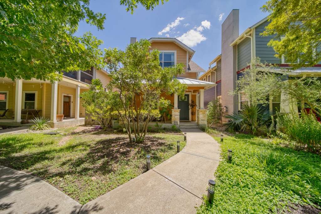4113 Camacho Street Austin, TX 78723 - Photo 4 of 36 a front view of a house with garden