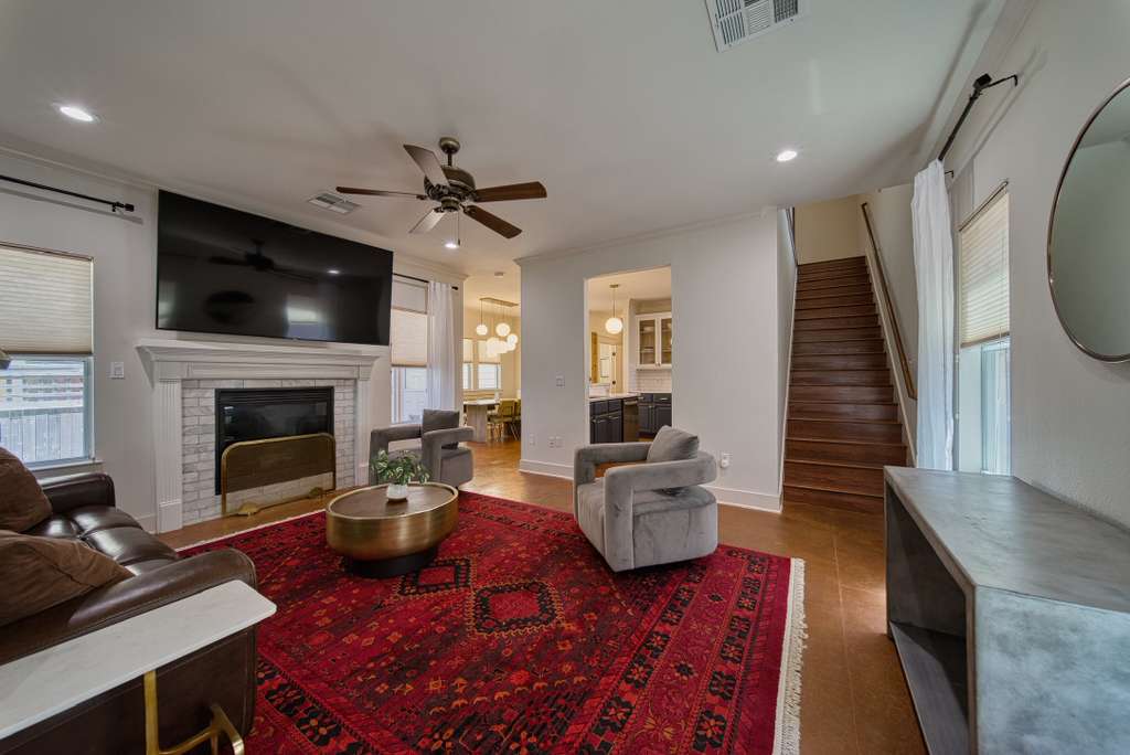4113 Camacho Street Austin, TX 78723 - Photo 9 of 36 a living room with furniture and a fireplace