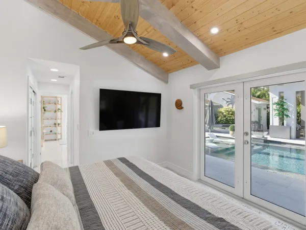 a kitchen with stainless steel appliances granite countertop a refrigerator sink and white cabinets