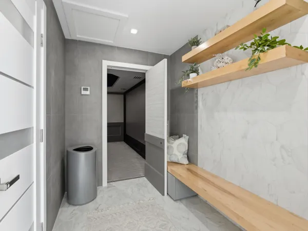 a bedroom with a bed and cabinets