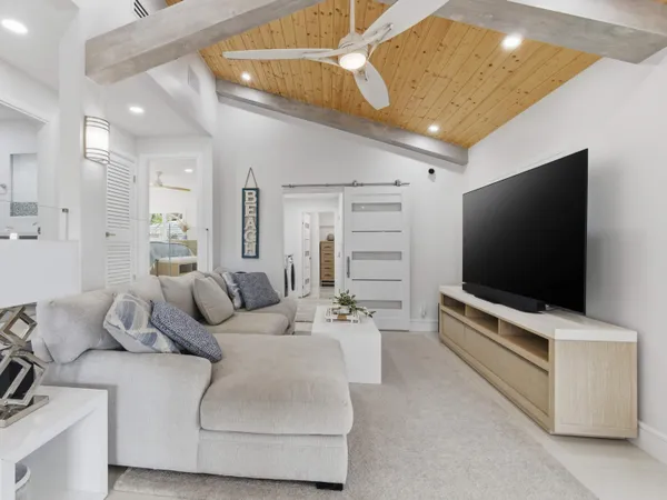 a kitchen with kitchen island cabinets and chairs in it