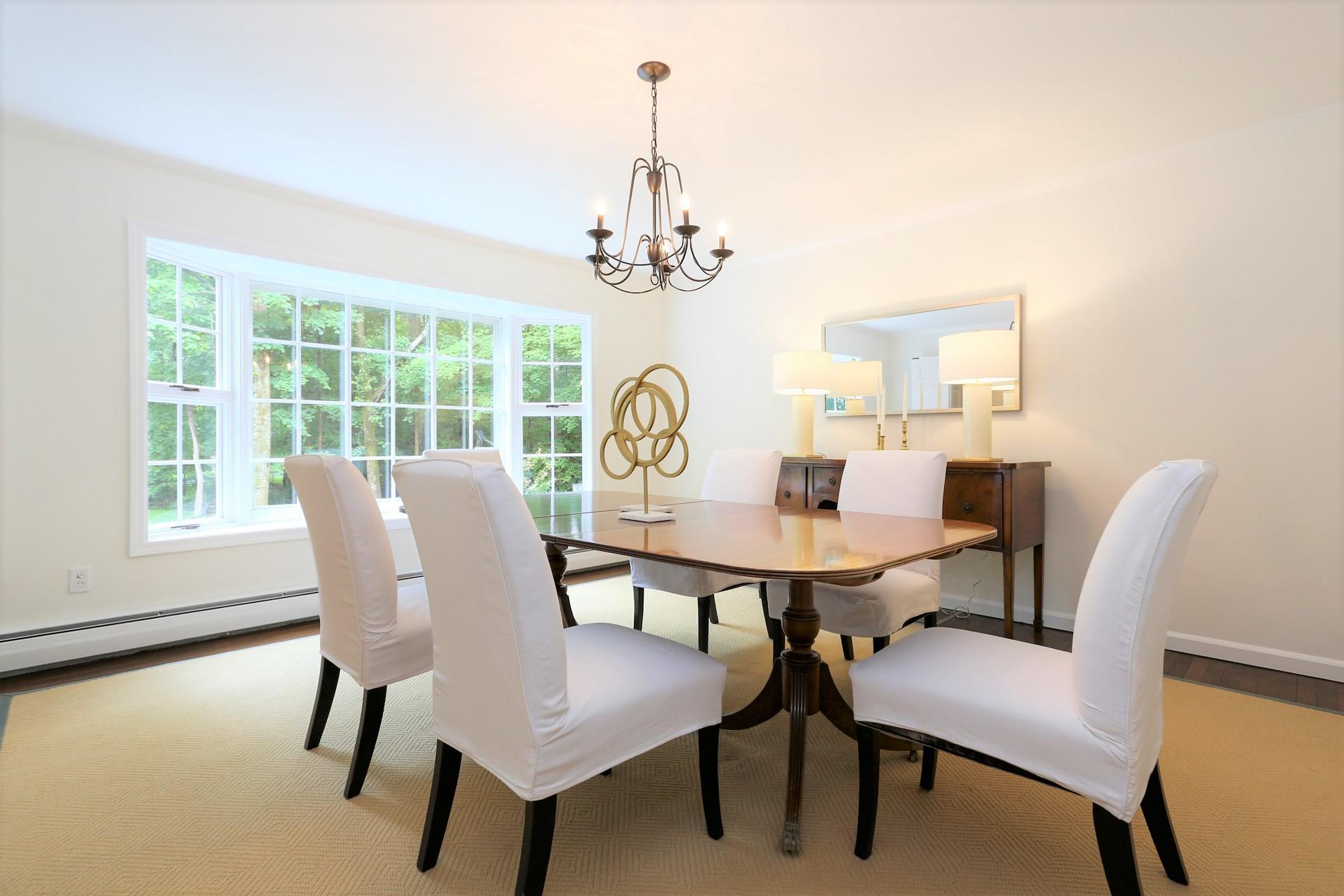 107 Inwood Road Darien, CT 06820 - Photo 8 of 40 a view of a dining room with furniture window and outside view
