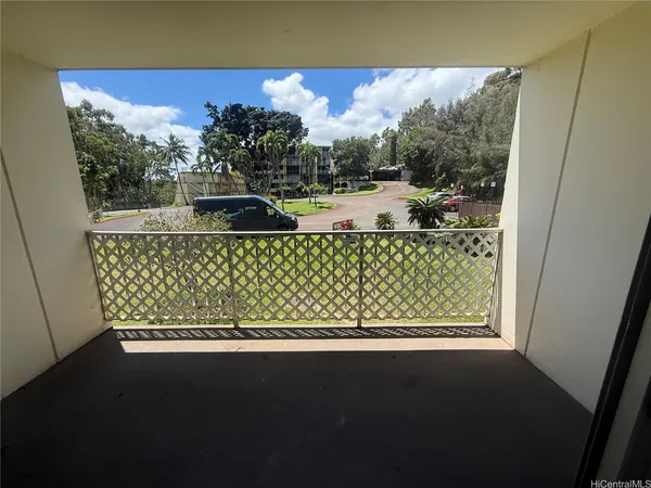 a view of balcony with furniture