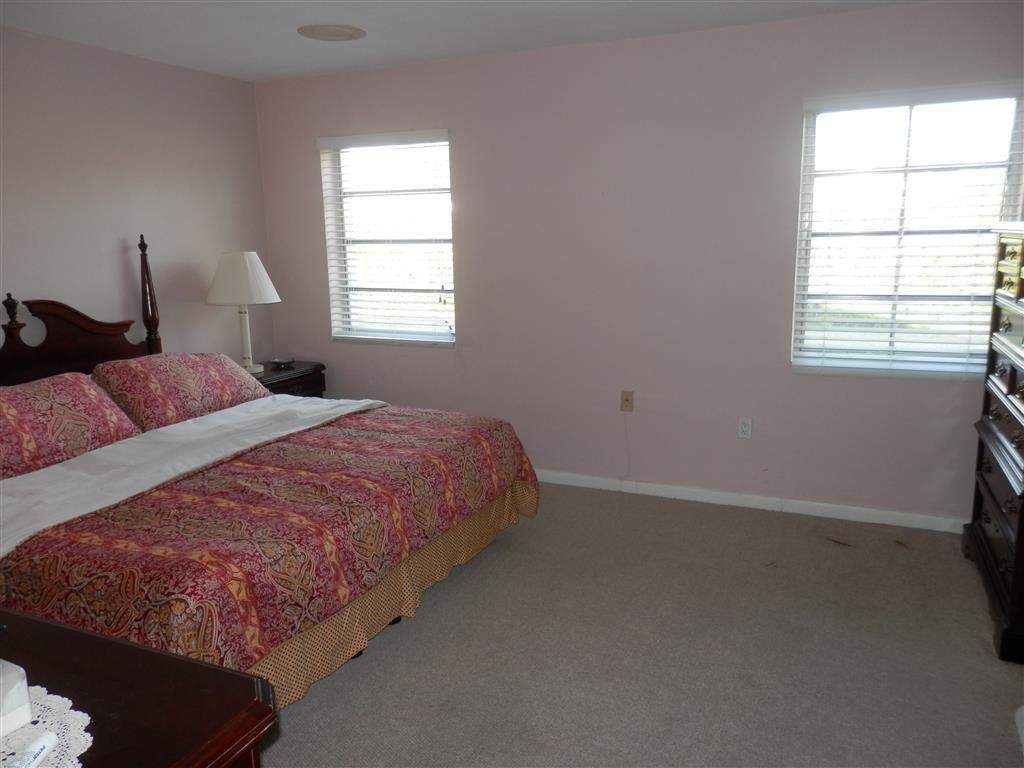 6311 Southwest 93rd Court Miami, FL 33173 - Photo 2 of 9 a bedroom with a bed and a window
