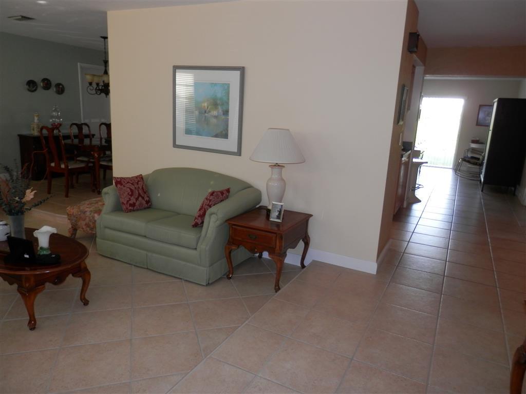 6311 Southwest 93rd Court Miami, FL 33173 - Photo 3 of 9 a living room with furniture and a rug