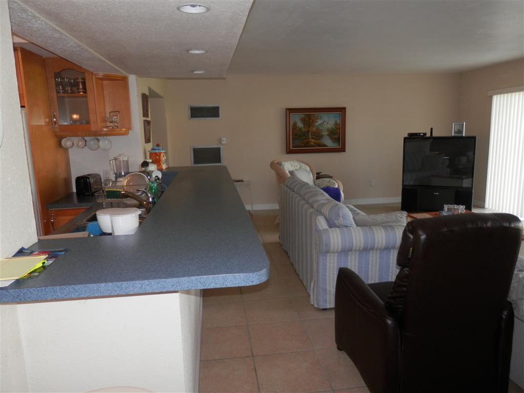 6311 Southwest 93rd Court Miami, FL 33173 - Photo 4 of 9 a living room with furniture and a flat screen tv