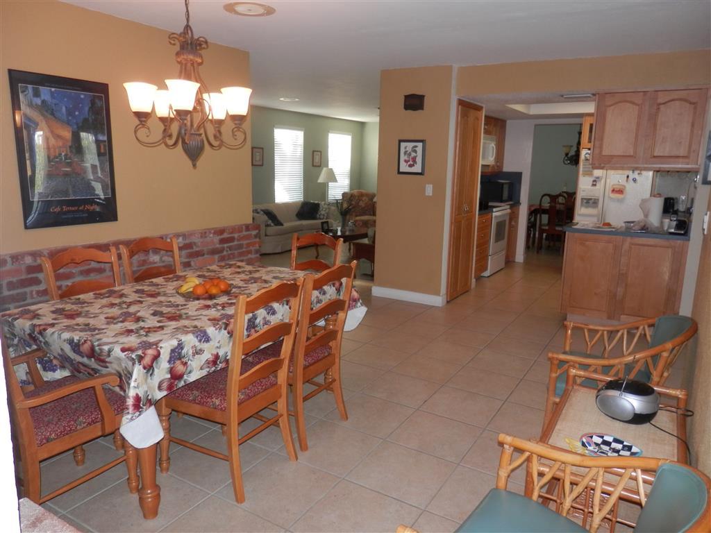 6311 Southwest 93rd Court Miami, FL 33173 - Photo 9 of 9 a view of a dining room with furniture and chandelier