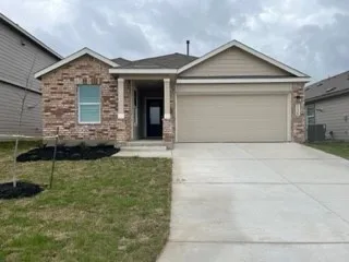 a front view of a house with garage