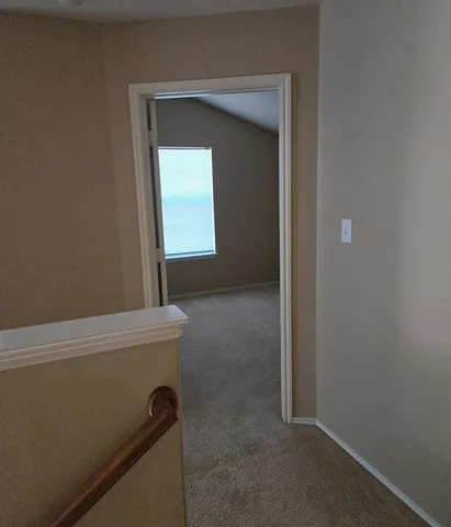 a view of a hallway with closet
