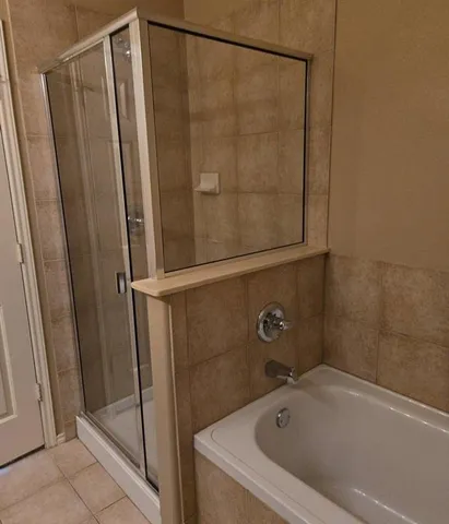 a bathroom with a shower and a sink