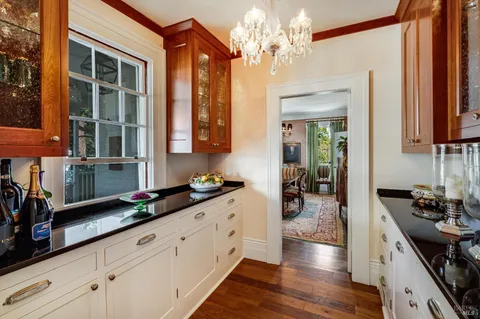 a kitchen with stainless steel appliances granite countertop a sink a stove and a refrigerator