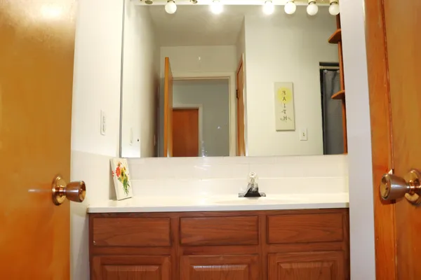 a bathroom with a sink and a mirror