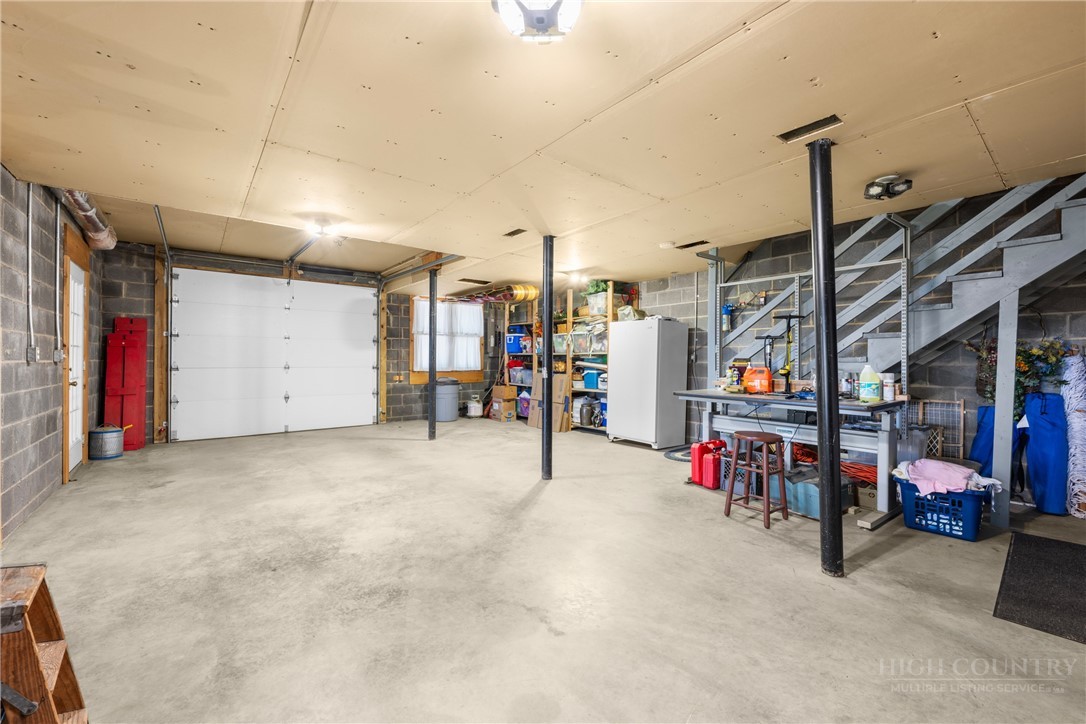 2177 Homestead Road Todd, NC 28684 - Photo 35 of 49 a view of a garage with cars