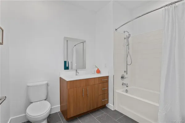 a bathroom with a toilet a sink and bathtub